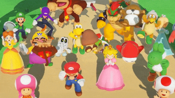 Mario, Peach, Yoshi et Bowser sautent bras levés sur le sable au milieu d'une vingtaine de personnages